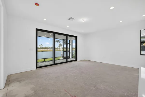 a kitchen with stainless steel appliances granite countertop a sink a stove and cabinets