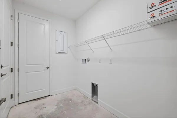 a living room with stainless steel appliances kitchen island granite countertop a large window