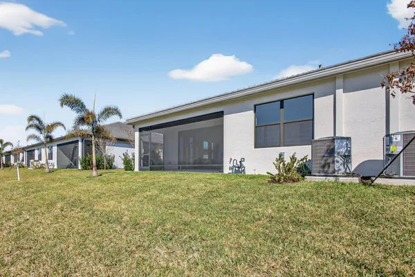 a view of a house with swimming pool and a porch