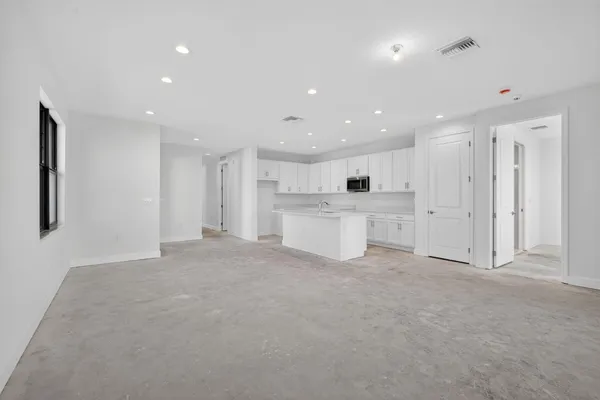 a stove top oven sitting inside of a kitchen