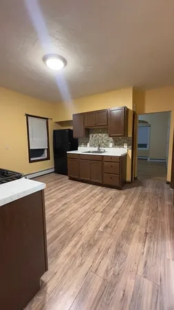 a spacious bedroom with a bed and furniture