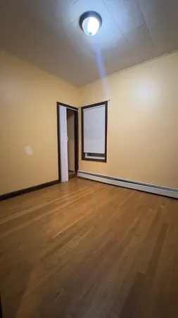an empty room with a empty space and a window