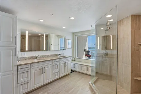 a bathroom with a shower and a sink