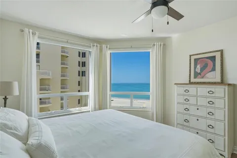 a view of balcony with two chairs and a table