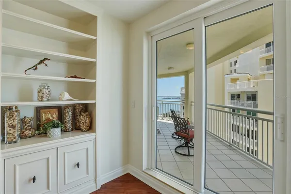 a view of a balcony with wooden floor