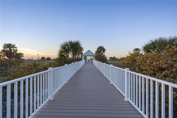 a living room with lots of furniture and a large window