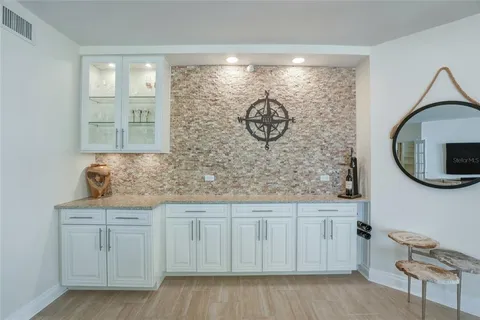 a kitchen with stainless steel appliances granite countertop a stove sink and microwave