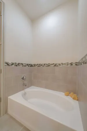 a bathroom with a bathtub and shower