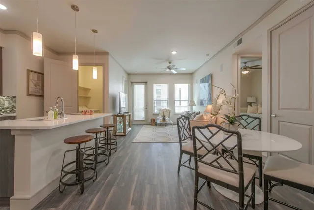 a view of a dining room with furniture and wooden floor