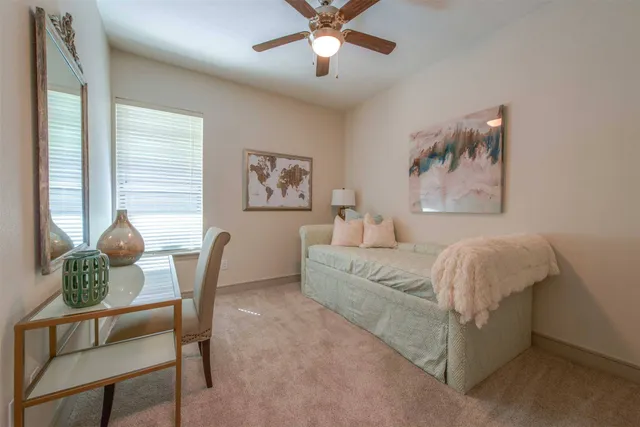 a living room with furniture and a window