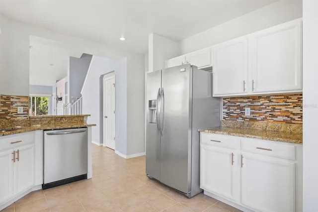 a view of a dining room with furniture and windows