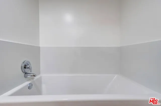 a bathroom with a sink a bathtub and a shower