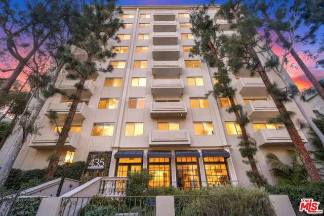 a view of a building with potted plants