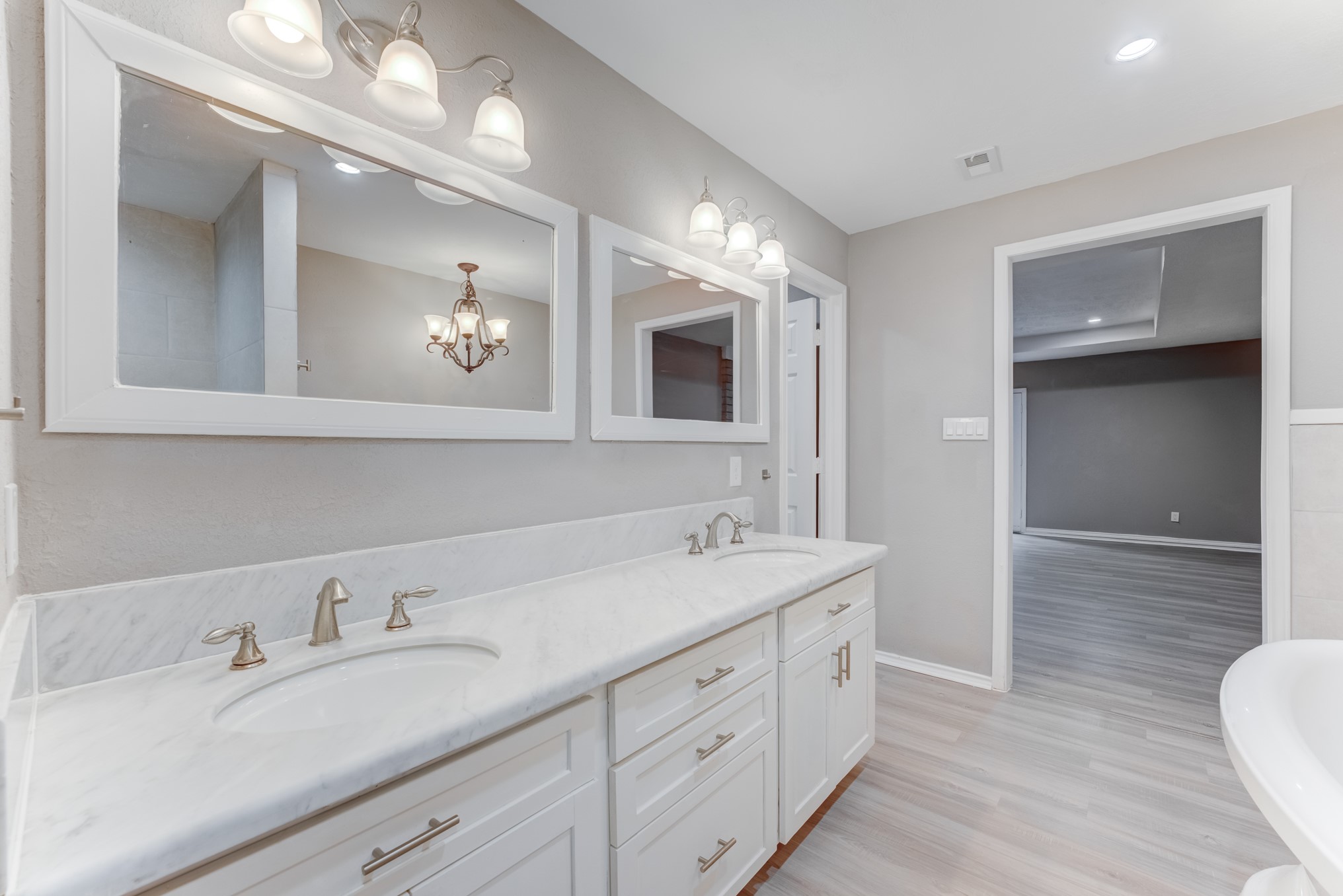 81 Oak Grove Lane Conroe, TX 77304 - Photo 29 of 50 a spacious bathroom with a double vanity sink and a mirror