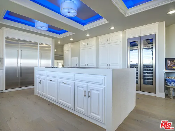 a spacious bathroom with a double vanity sink and a mirror