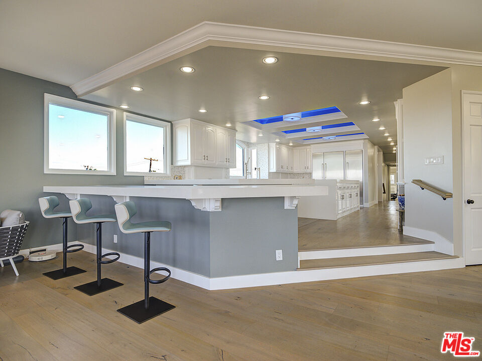 7800 Veragua Drive, Unit 1 Playa del Rey, CA 90293 - Photo 13 of 42 a kitchen with a sink cabinets and window