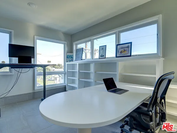 a view of a livingroom with furniture and window
