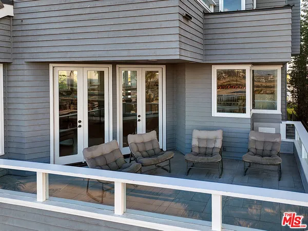 a view of a house with wooden floor and outdoor space