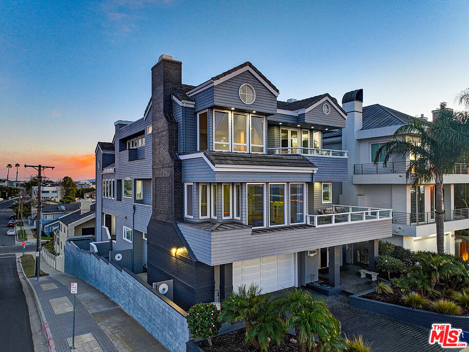 7800 Veragua Drive, Unit 1 Playa del Rey, CA 90293 - Photo 4 of 42 a front view of a building with many windows