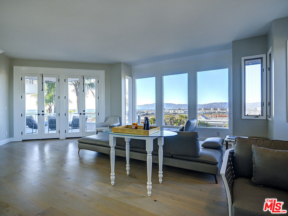 7800 Veragua Drive, Unit 1 Playa del Rey, CA 90293 - Photo 8 of 42 a living room with furniture and a large window
