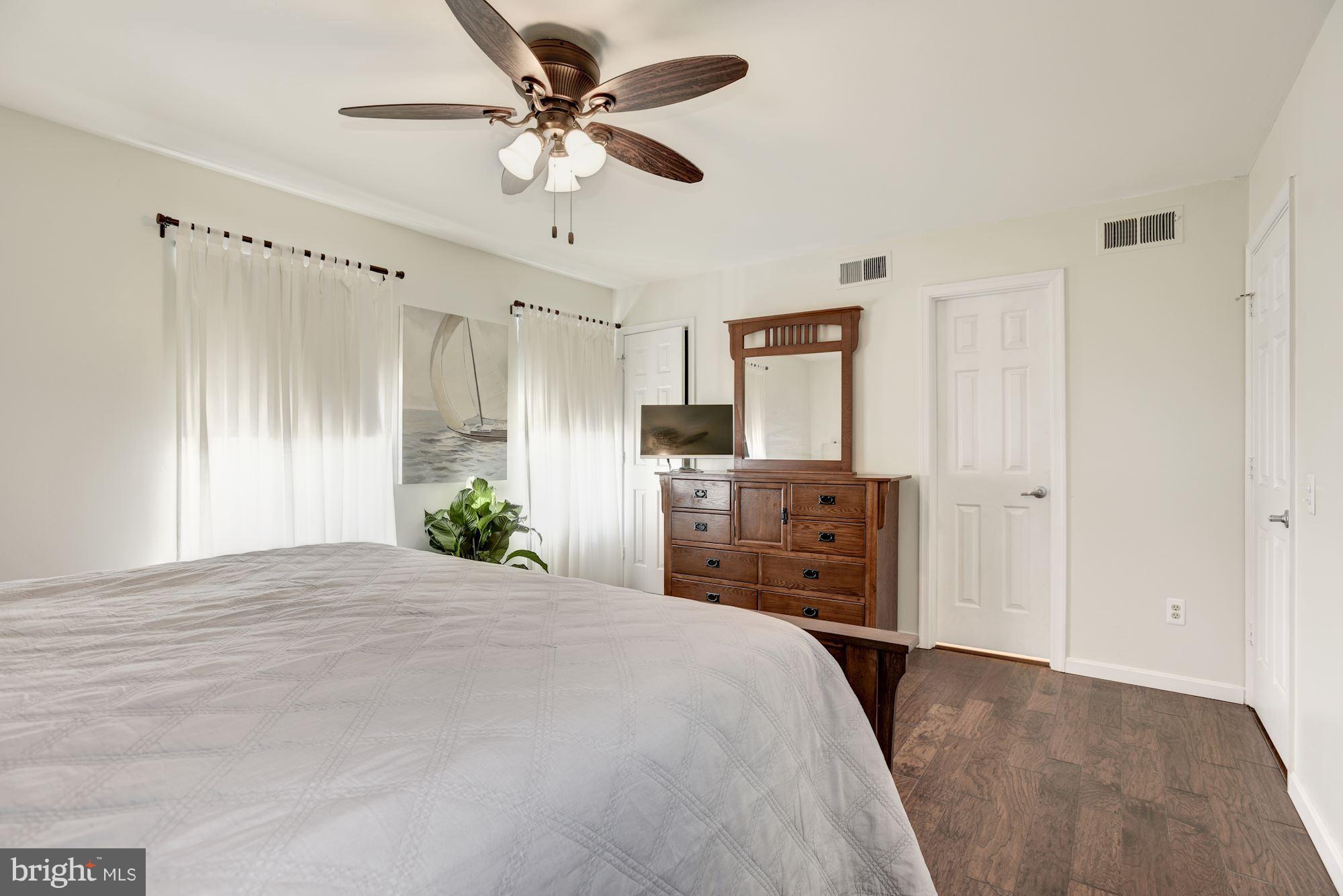 124 Fort Evans Road Southeast, Unit E Leesburg, VA 20175 - Photo 17 of 29 Master Bedroom with Hardwood Floors