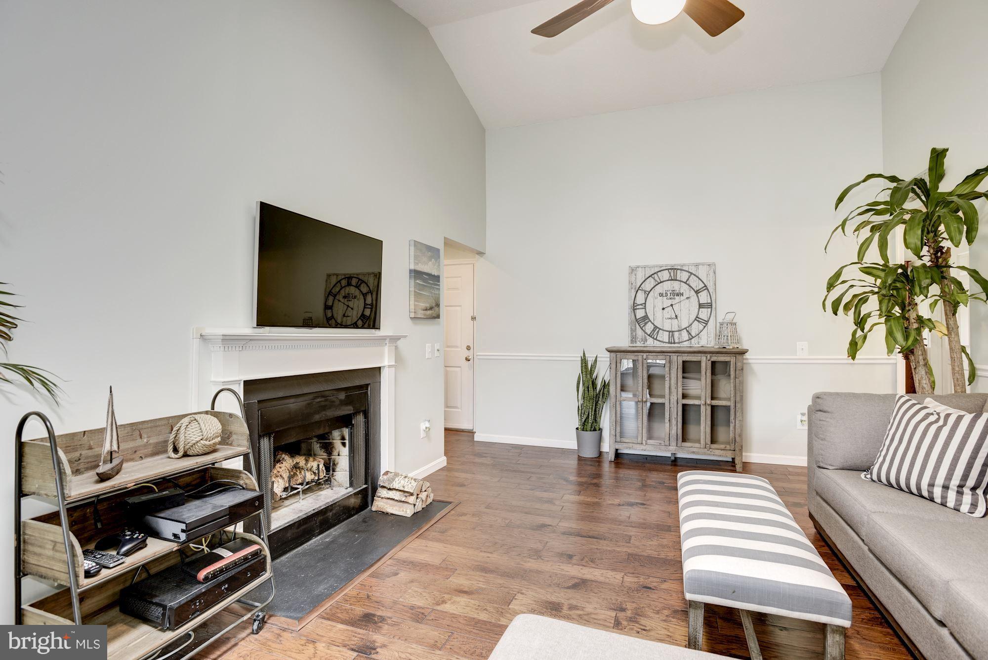 124 Fort Evans Road Southeast, Unit E Leesburg, VA 20175 - Photo 9 of 29 Living Room with Wood Fireplace