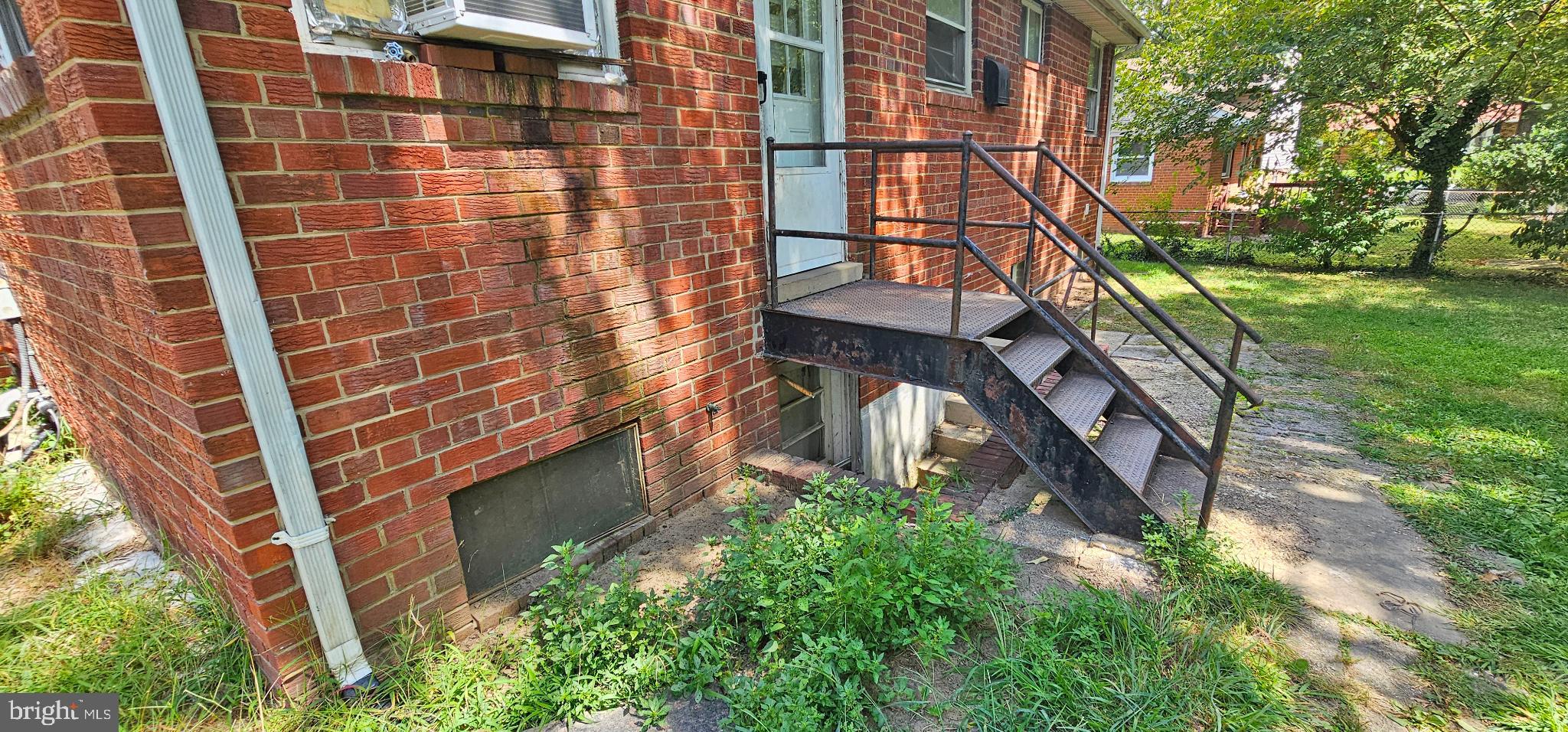 8517 Oglethorpe Street Hyattsville, MD 20784 - Photo 14 of 15 a yellow building with trees in front of it