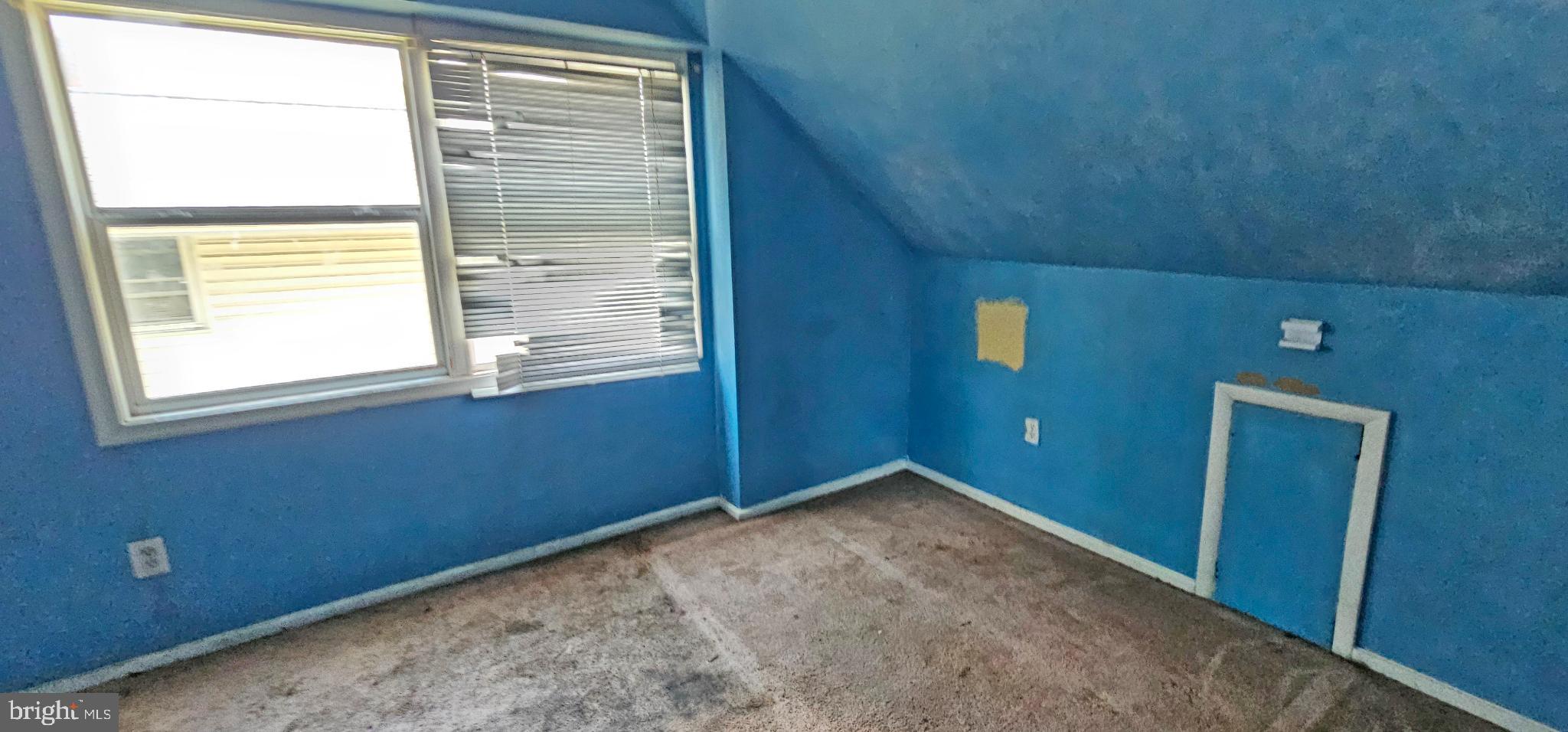 8517 Oglethorpe Street Hyattsville, MD 20784 - Photo 8 of 15 a view of an empty room with a window