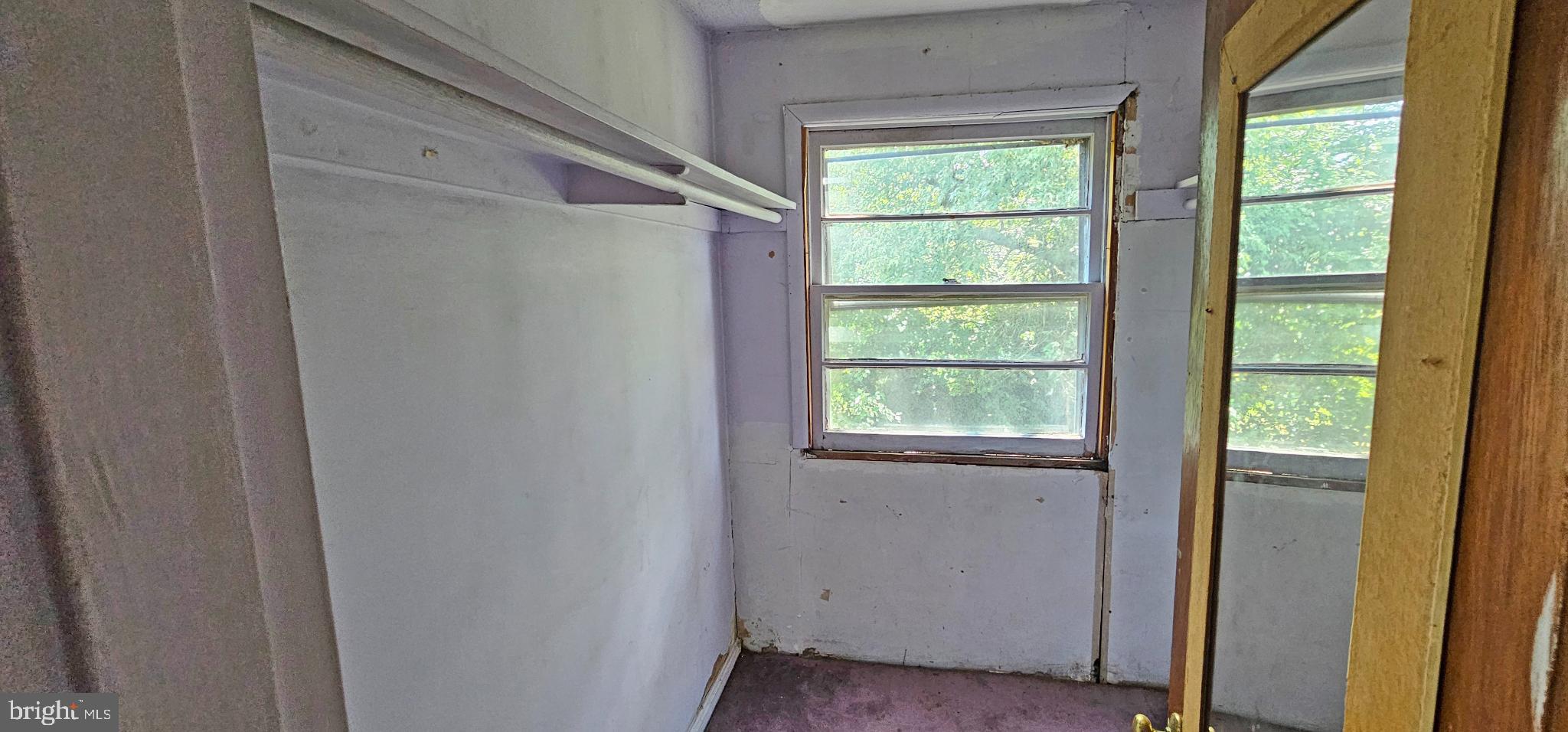 8517 Oglethorpe Street Hyattsville, MD 20784 - Photo 9 of 15 a view of an empty room with a window