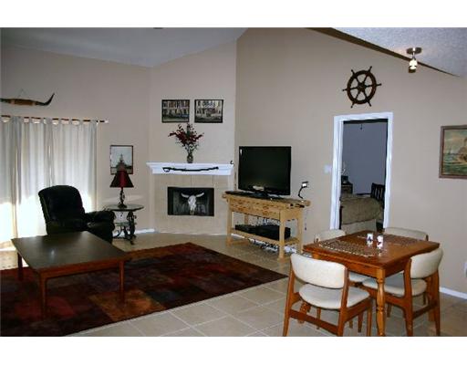 15525 Dyna Street Corpus Christi, TX 78418 - Photo 3 of 8 a living room with furniture and a flat screen tv
