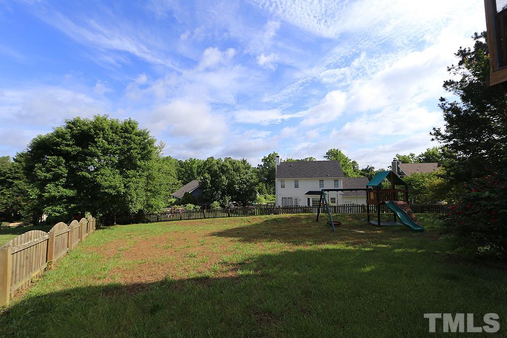 3221 Leebrook Road Raleigh, NC 27616 - Photo 11 of 12 a view of a large garden with a bench