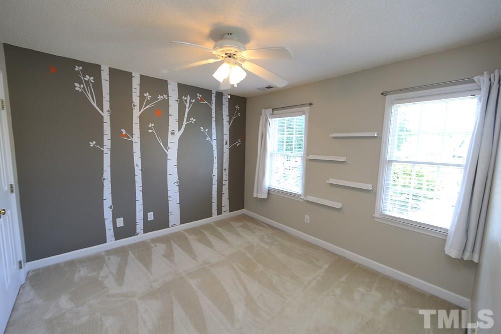 3221 Leebrook Road Raleigh, NC 27616 - Photo 9 of 12 a view of an empty room with a window