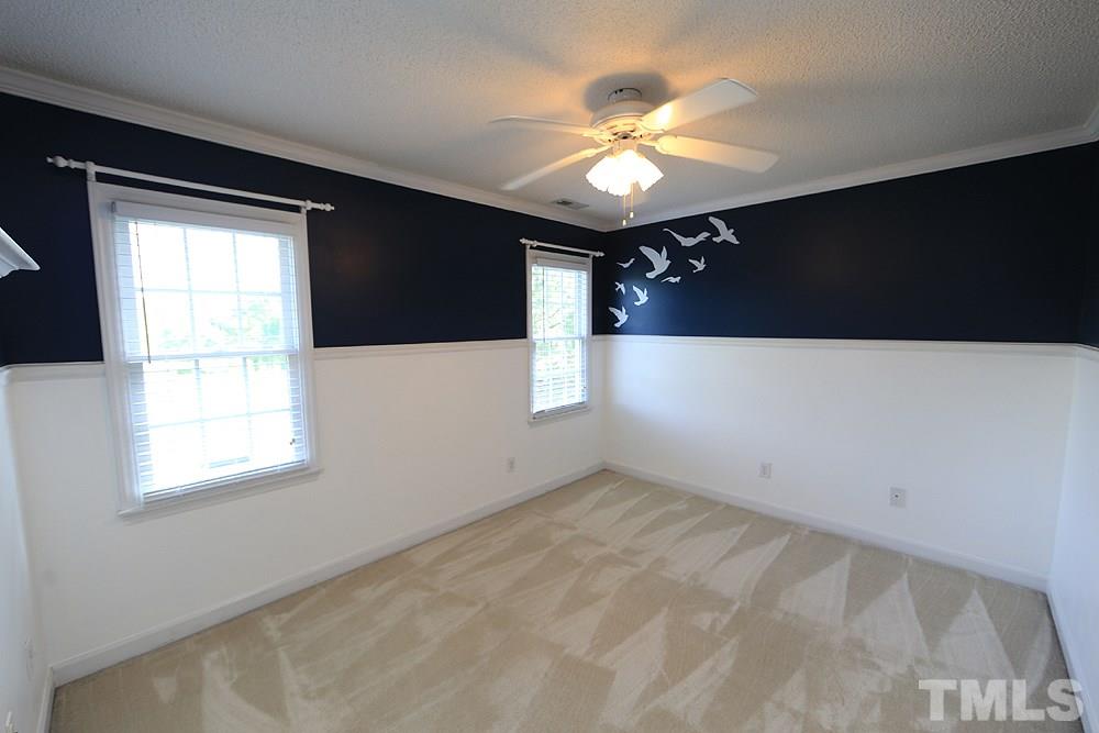 3221 Leebrook Road Raleigh, NC 27616 - Photo 10 of 12 a view of an empty room with a window
