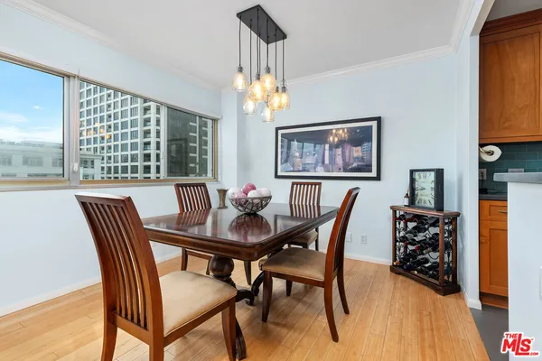 a view of a dining room with furniture window and wooden floor