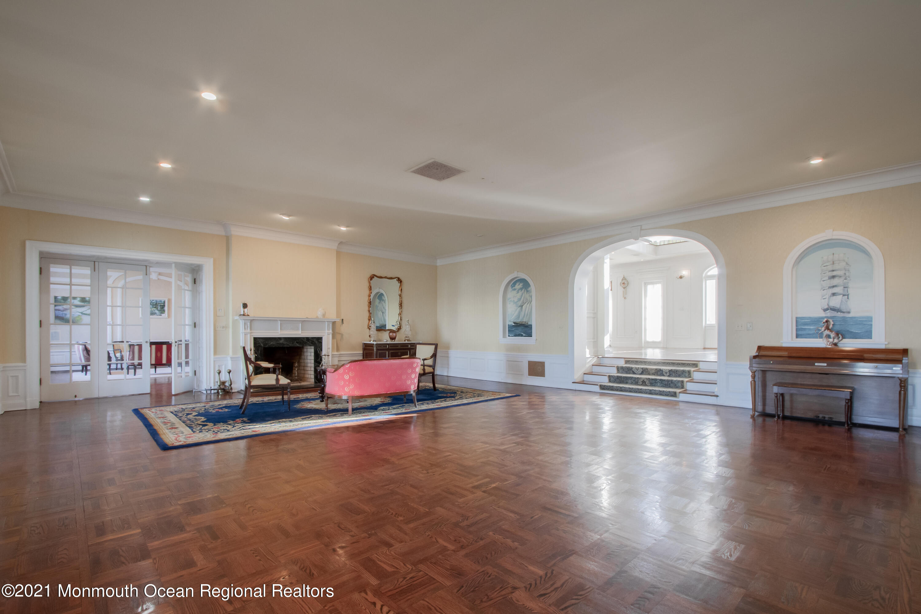 29 Ward Avenue Rumson, NJ 07760 - Photo 20 of 25 a living room with fireplace furniture and a wooden floor