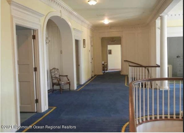 29 Ward Avenue Rumson, NJ 07760 - Photo 21 of 25 a view of a hallway with wooden floor and a living room