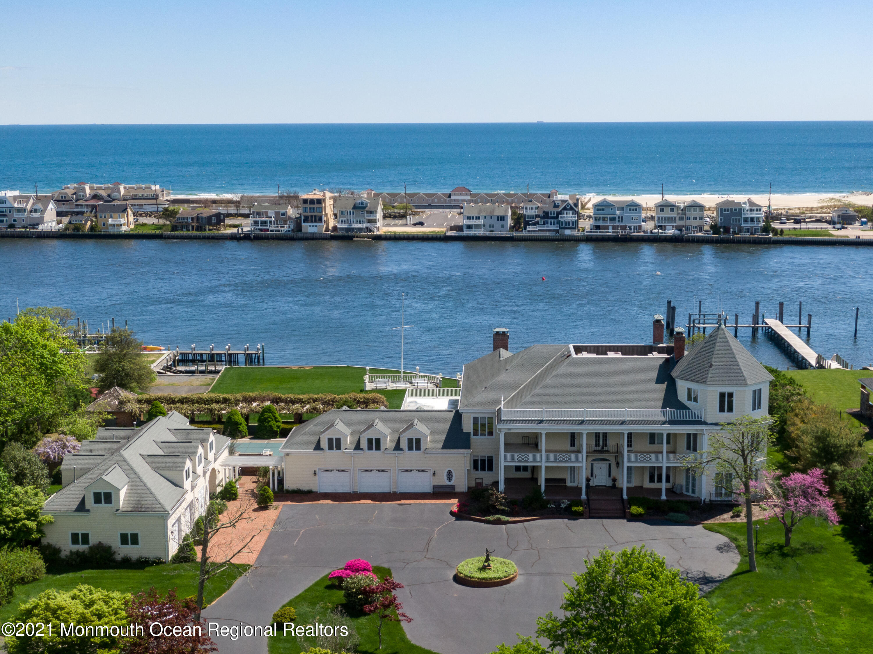 29 Ward Avenue Rumson, NJ 07760 - Photo 4 of 25 an aerial view of a house with a garden and lake view