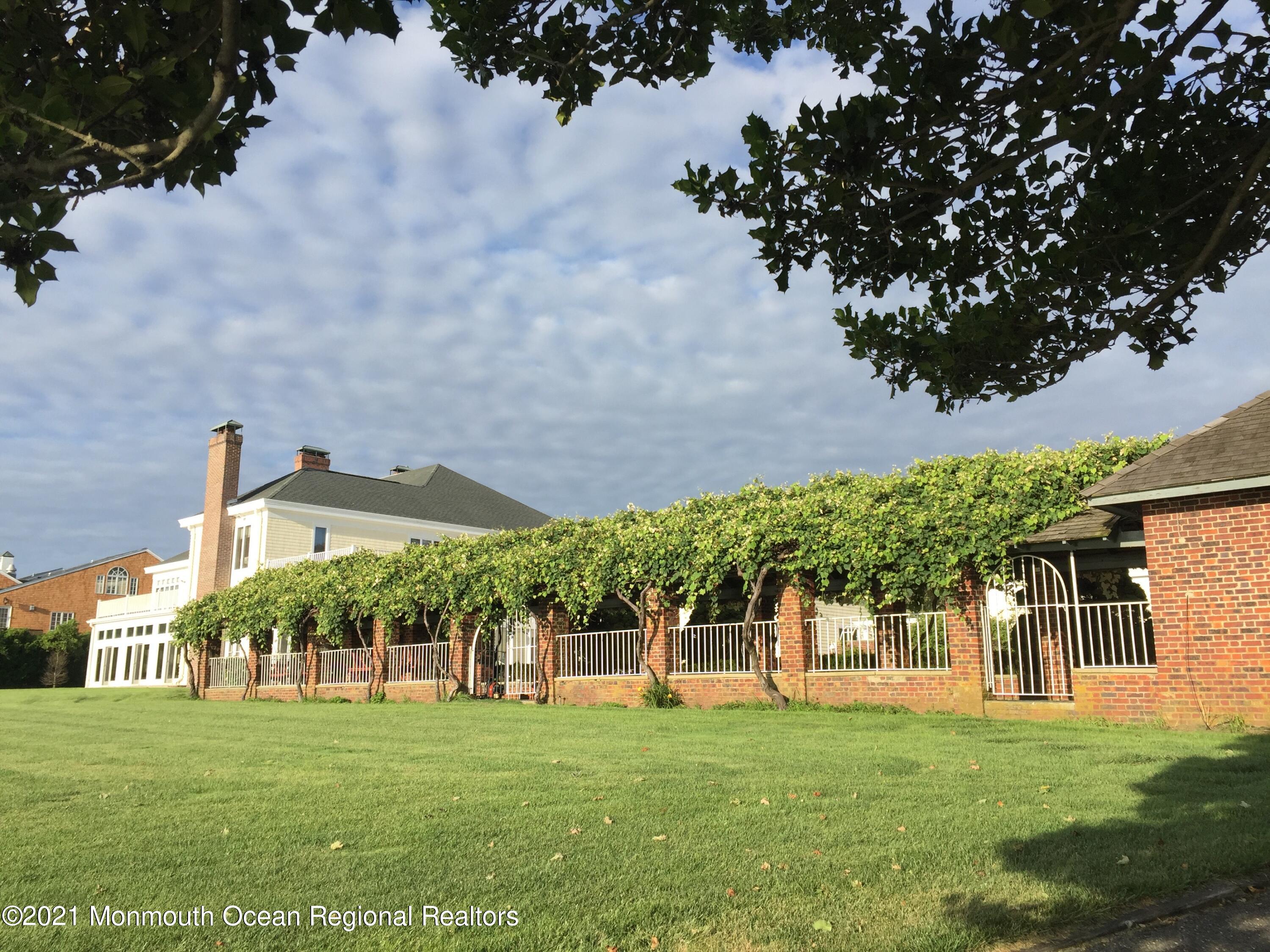 29 Ward Avenue Rumson, NJ 07760 - Photo 5 of 25 front view of a house with a big yard
