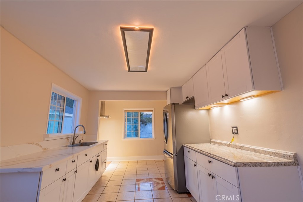 487 Jackson Street Colton, CA 92324 - Photo 11 of 47 Kitchen ceiling night light feature. Cabinet lights are battery operated.
