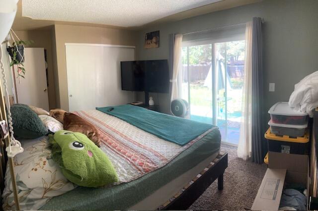 20158 Mapleleaf Street Burney, CA 96013 - Photo 17 of 33 a bedroom with a bed and large windows