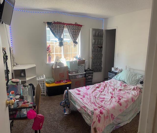 20158 Mapleleaf Street Burney, CA 96013 - Photo 19 of 33 a bedroom with bed and a window