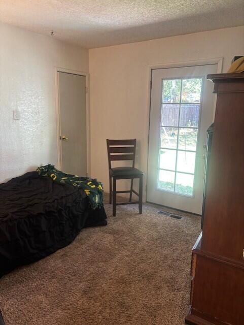 20158 Mapleleaf Street Burney, CA 96013 - Photo 21 of 33 a bedroom with a bed and a window