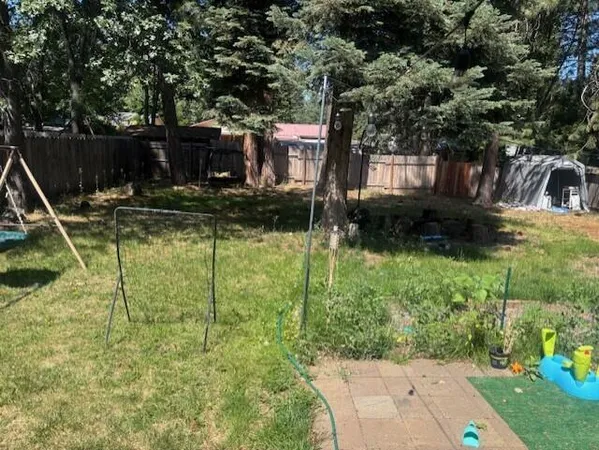 a backyard of a house with lots of green space