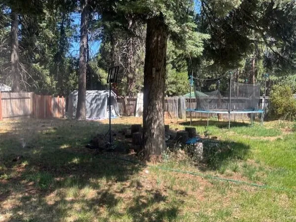 a backyard of a house with lots of green space
