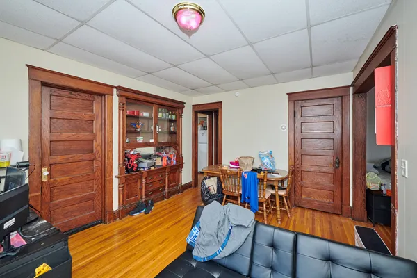 a living room with furniture window and wooden floor