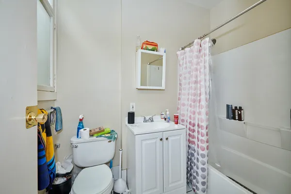 a bedroom with bed and a window