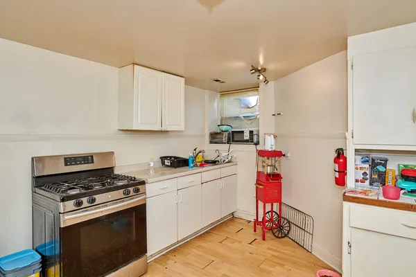 a room with furniture a flat screen tv and a window