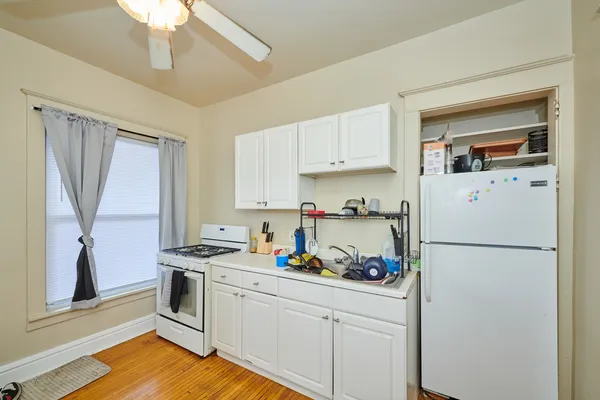 a view of a livingroom with workspace and a window