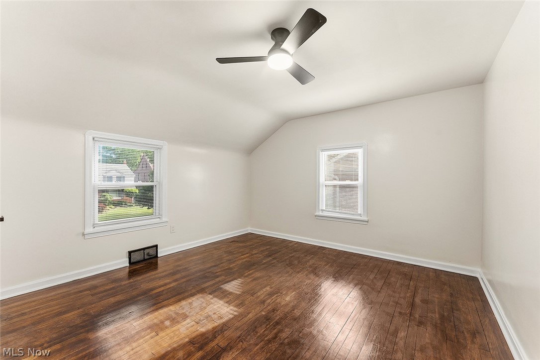 3791 Fairoaks Road South Euclid, OH 44121 - Photo 15 of 30 Bright room with wood-finish flooring, two windows, and a ceiling fan with integrated lighting