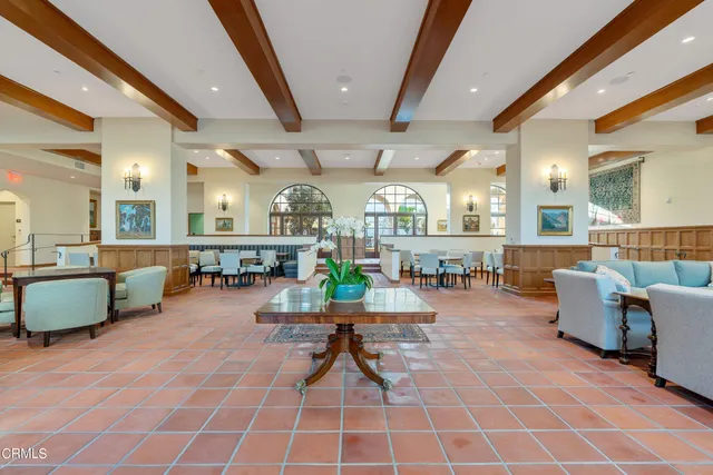 a view of a hallway with windows and closet